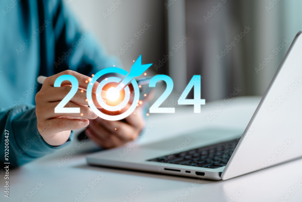 Target vision of the 2024 year, Start planning, and action plan for the business new year. Businesswomen touching virtual icon target goal 2024 Target vision of the 2024 year, Start planning, and action plan for the business new year. Businesswomen touching virtual icon target goal 2024