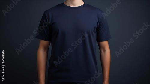 A person wearing navy blue t shirt isolated on solid background