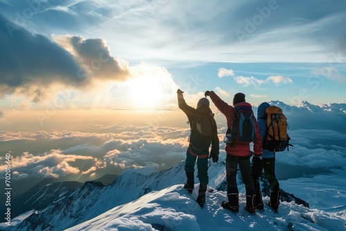 A family's victorious moment at the mountaintop, their supportive gestures and unified stance a powerful illustration of the success that comes from working together as a team. photo
