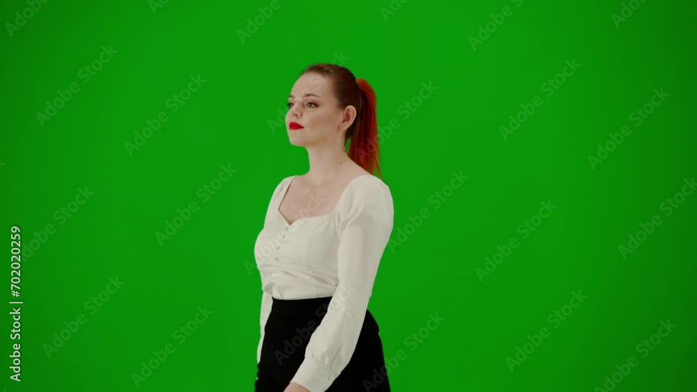 Portrait of attractive office girl on chroma key green screen. Woman in skirt and blouse walking cutely. Half turn. Portrait of attractive office girl on chroma key green screen. Woman in skirt and blouse walking cutely. Half turn.