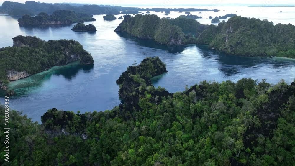 Rugged, limestone islands rise from the impressive seascape in Misool, Raja Ampat, Indonesia. These scenic islands' coral reefs, and the surrounding seas, support extraordinary marine biodiversity. Rugged, limestone islands rise from the impressive seascape in Misool, Raja Ampat, Indonesia. These scenic islands' coral reefs, and the surrounding seas, support extraordinary marine biodiversity.