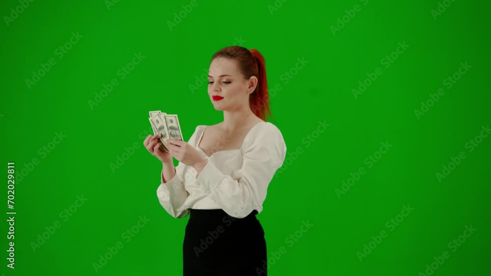 Portrait of attractive office girl on chroma key green screen. Woman in skirt and blouse walking and counting money, happy face expression. Half turn. Portrait of attractive office girl on chroma key green screen. Woman in skirt and blouse walking and counting money, happy face expression. Half turn.