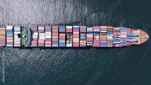 Overhead view of slow-moving container ship plying the trade routes around the Cape of Good Hope, South Africa. Loaded with freight containers photo