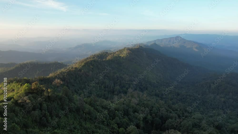 Aerial landscape view of greenery mountains and dirt road by drone Aerial landscape view of greenery mountains and dirt road by drone