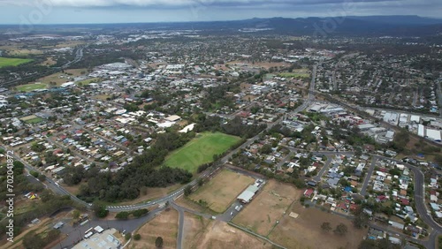 Residential Houses And Playing Field In Loganholme Suburb, Logan City, Queensland, Australia. aerial pullback shot photo