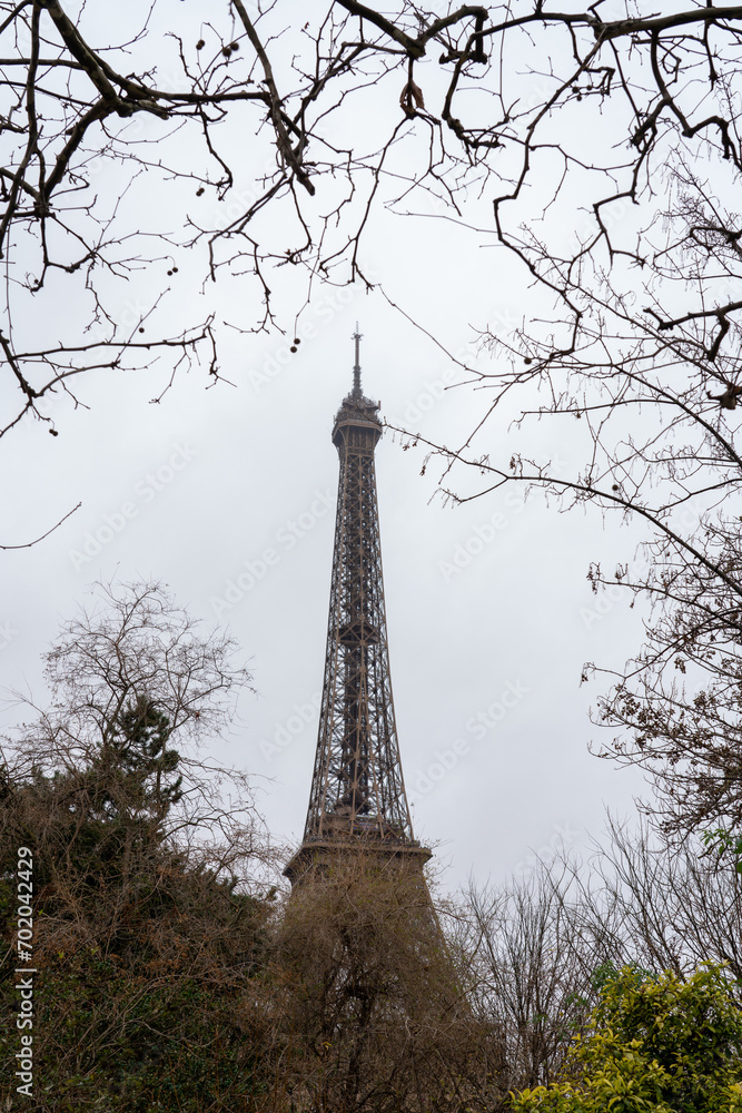 Then Eiffel in Paris in the park whit trees