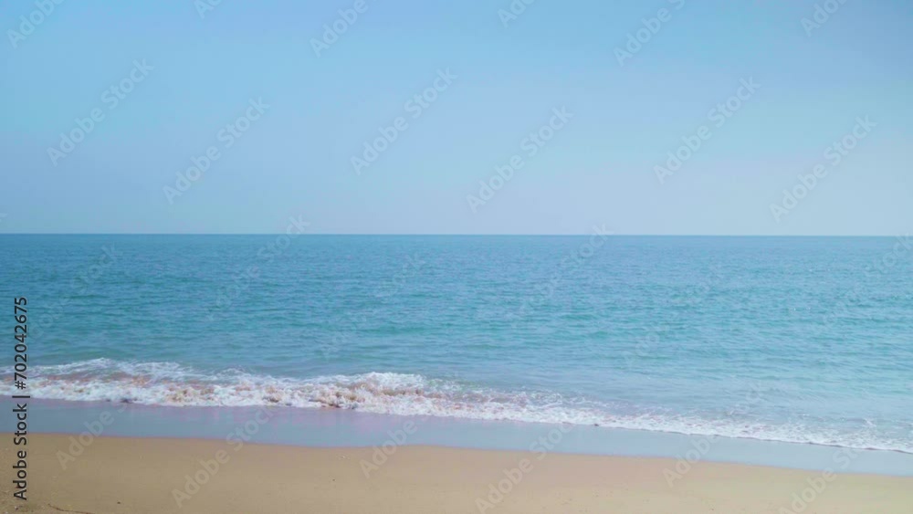 Ocean sandy beach and blue water, Waves hit the beautiful sandy beach of Pranburi Beach, Thailand Ocean sandy beach and blue water, Waves hit the beautiful sandy beach of Pranburi Beach, Thailand