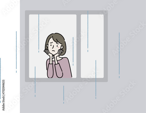 雨で憂鬱な女性