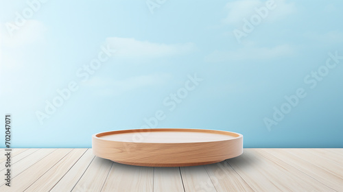empty wooden deck table with podium over light blue wallpaper background