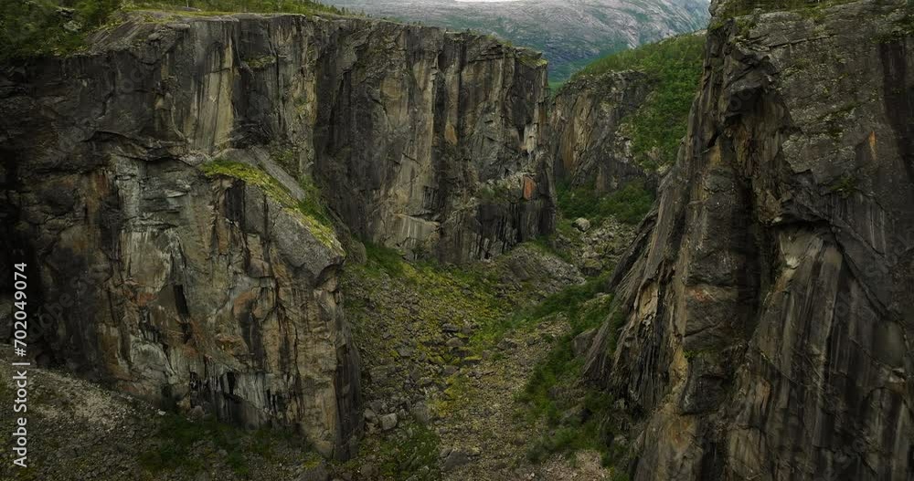 A Gap On The Rocky Cliffs Of Hellmo Canyon, Tysfjord, Northern Norway. Aerial Drone Shot A Gap On The Rocky Cliffs Of Hellmo Canyon, Tysfjord, Northern Norway. Aerial Drone Shot