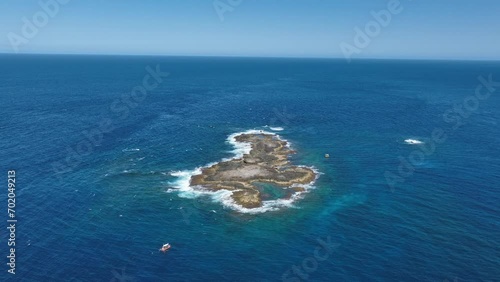 Aerial Drone shot orbiting Stradbroke Islands Point Look Out Manta Bommie Dive Site, a small island off the coast of Stradbroke Island. 4k QLD AUSTRALIA TOURISM photo