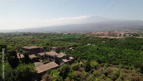 Beautiful Drone Shot of Castello degli Schiavi and Mount Etna in the Background in Sicily, Italy photo