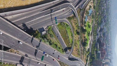 Aerial View Of Highway Roads Beside Bicentenario Park In Santiago, Chile. Vertical Video, Push Forward, Tilt Up photo
