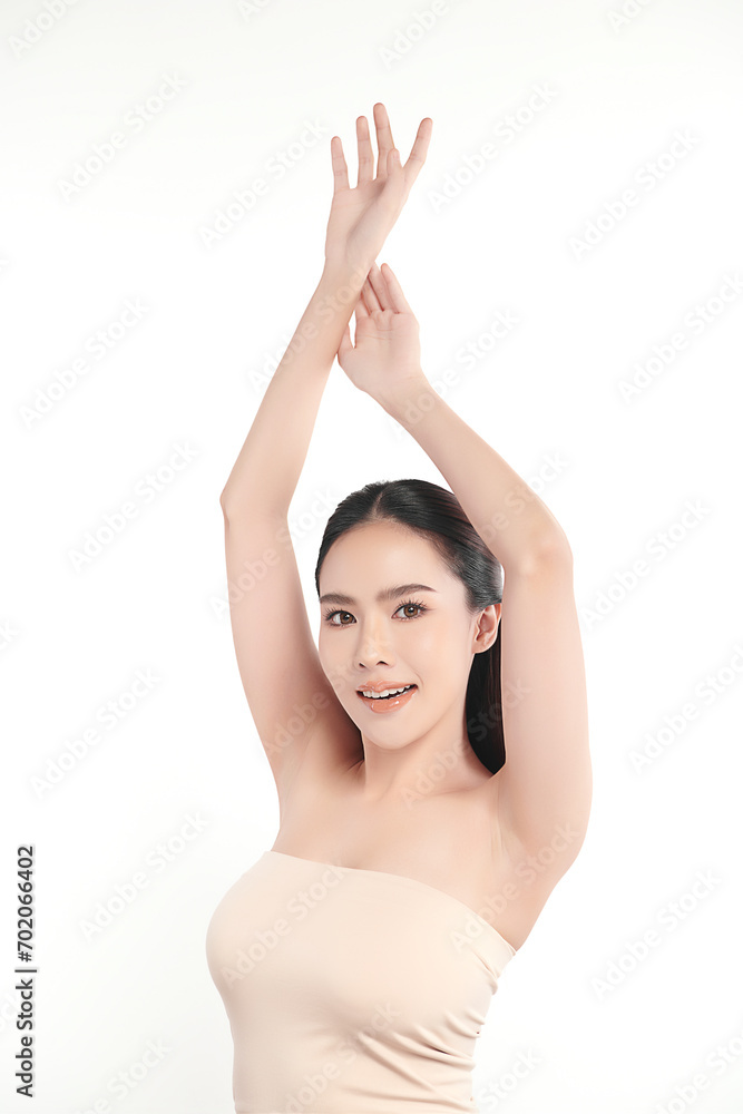 Beautiful Young Asian woman lifting hands up to show off clean and hygienic armpits or underarms on white background, Smooth armpit cleanliness and protection concept Beautiful Young Asian woman lifting hands up to show off clean and hygienic armpits or underarms on white background, Smooth armpit cleanliness and protection concept