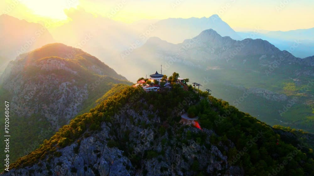 Aerial 4K drone video of a Tunektepe Teleferik
Cable station positioned on top of the hill with the mountains in the background. View point and attraction located in Antalya, Turkey.