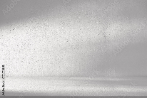 White Wall Studio Background.Empty Grey Room Background with Light, Leaves Shadow on Table Top Surface Texture,Backdrop Mockup Display Podium Design for displaying product present of Cosmetic Banner photo
