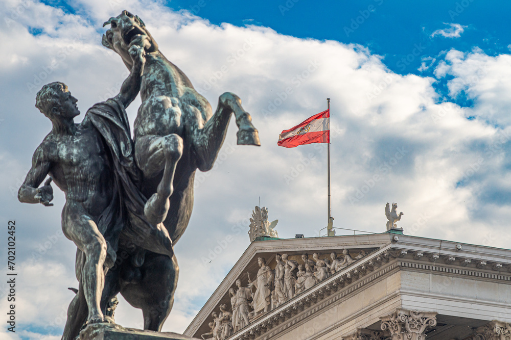 Obraz premium The Austrian Parliament Building in Vienna, Austria. Austrian Parliament building is located on Ringstrasse in Innere Stadt, near Hofburg Palace, Wien.