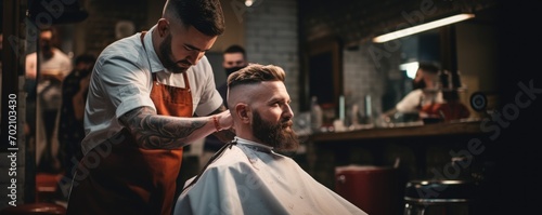 Hipster customer sitting on the chair in barber shop