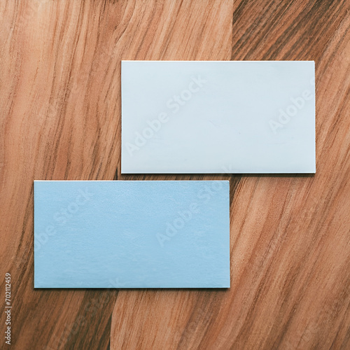 Blank business cards on wooden background photo