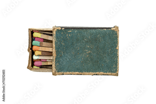 Canvas Print old matchbox with many colored matches on white background
