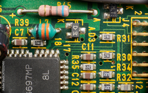 Detail of old electronic components of a motherboard with its chips, capacitors and solders