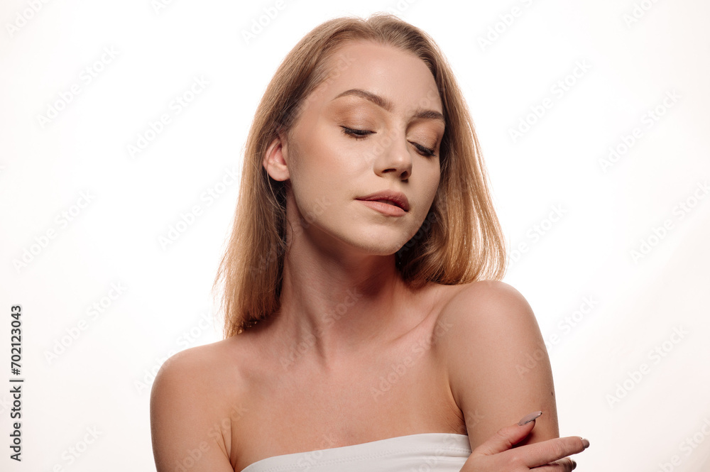 Beauty portrait of pretty blonde girl on white isolated background. Skin care concept Beauty portrait of pretty blonde girl on white isolated background. Skin care concept