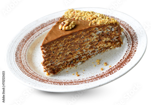 Waffle cake with condensed milk cream and walnuts on White Background