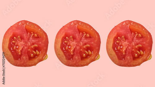 pink background tomato slices