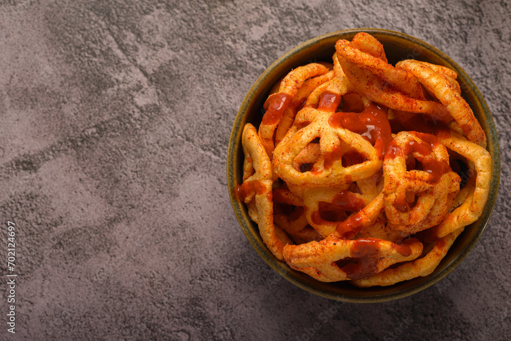 Fried Mexican wheat chips with hot sauce. Duritos, typical Mexican snack. Fried Mexican wheat chips with hot sauce. Duritos, typical Mexican snack.