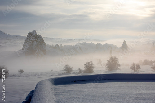 Pigeon Valley and Cave town in Göreme in winter, Fairy chimneys, Cappadocia, Turkey.