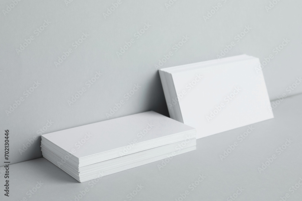 Blank business cards on light gray background. Mockup for design Blank business cards on light gray background. Mockup for design