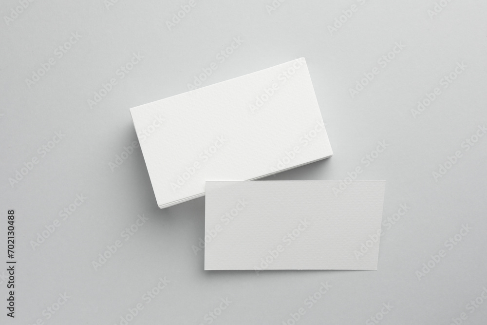 Blank business cards on light grey background, top view. Mockup for design Blank business cards on light grey background, top view. Mockup for design