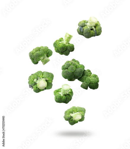 Fresh green broccoli falling on white background