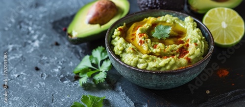 Avocado hummus in a gray bo...