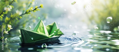 Clean energy for sea and cargo transportation and travel and sustainable maritime transport concept Paper boat emitting fresh green leaves. with copy space image. Place for adding text or design photo