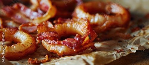 Bacon wrapped onion rings on parchment paper. with copy space image. Place for adding text or design