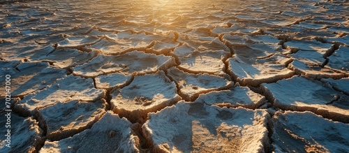Dry and cracked land dry due to lack of rain Effects of climate change such as desertification and droughts Aerial view of salt lake. with copy space image. Place for adding text or design