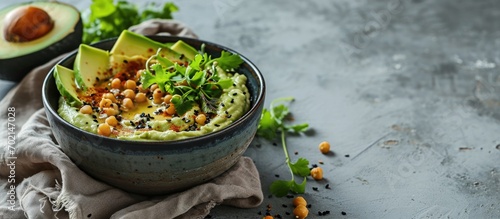 Avocado hummus in a gray bo...