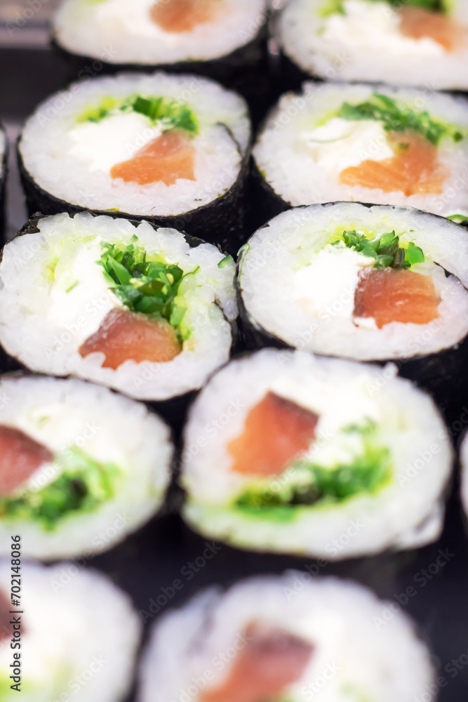 rolls with tuna on display close up