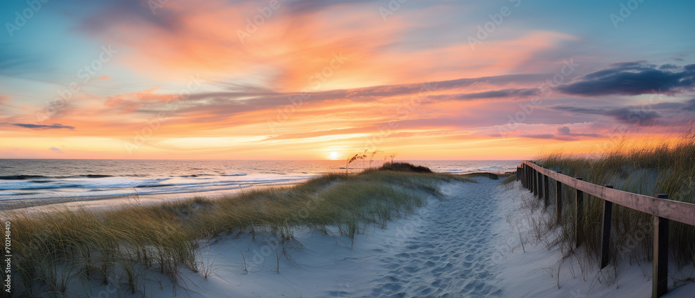 Ultra-wide image showing a beach trail and scanning the horizon during sunrise