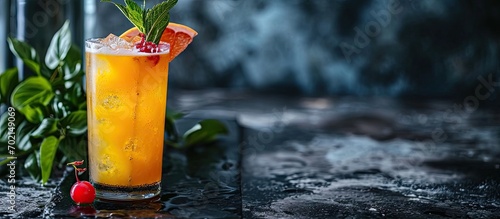 Grapefruit or Cherry Radler citrus beer cocktail Refreshing fruit beer drink on black table copy space. with copy space image. Place for adding text or design