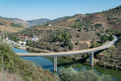 Ponte sobre o rio Tua com a estação de comboios da Brunheda ao fundo em Trás os Montes, Portugal photo