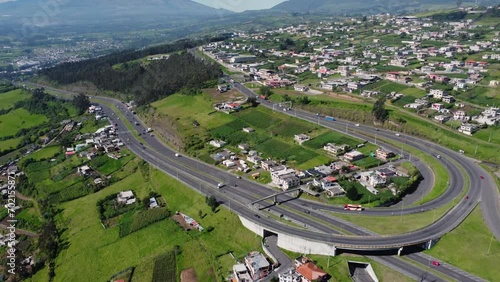 Witness the majestic Santa Rosa Curve from an elevated perspective with this zoom-out aerial video in Cutuglahua parish, Mejía Canton. A visual spectacle unveiling the panoramic beauty of the region photo
