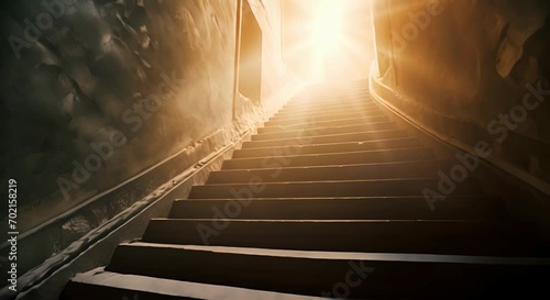 A staircase leading upwards towards bright light, walls covered with dust. The concept of hope and rebirth. photo
