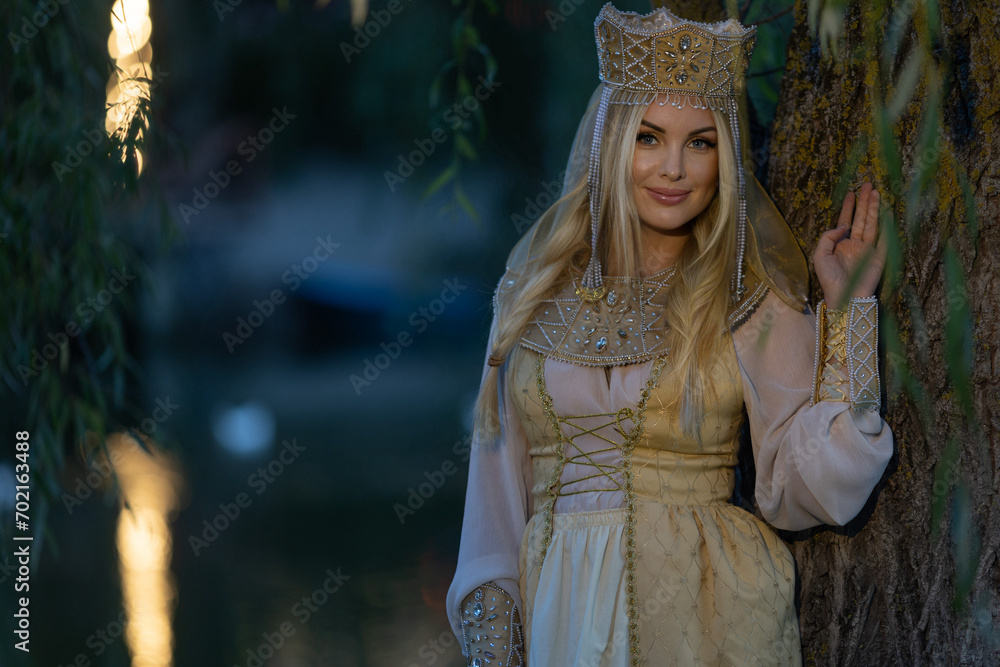 A beautiful Russian girl in a kokoshnik (crown). She has a Pavloposad shawl on her shoulders. Russian style, folk, retro, ethno. Selective focus photo A beautiful Russian girl in a kokoshnik (crown). She has a Pavloposad shawl on her shoulders. Russian style, folk, retro, ethno. Selective focus photo