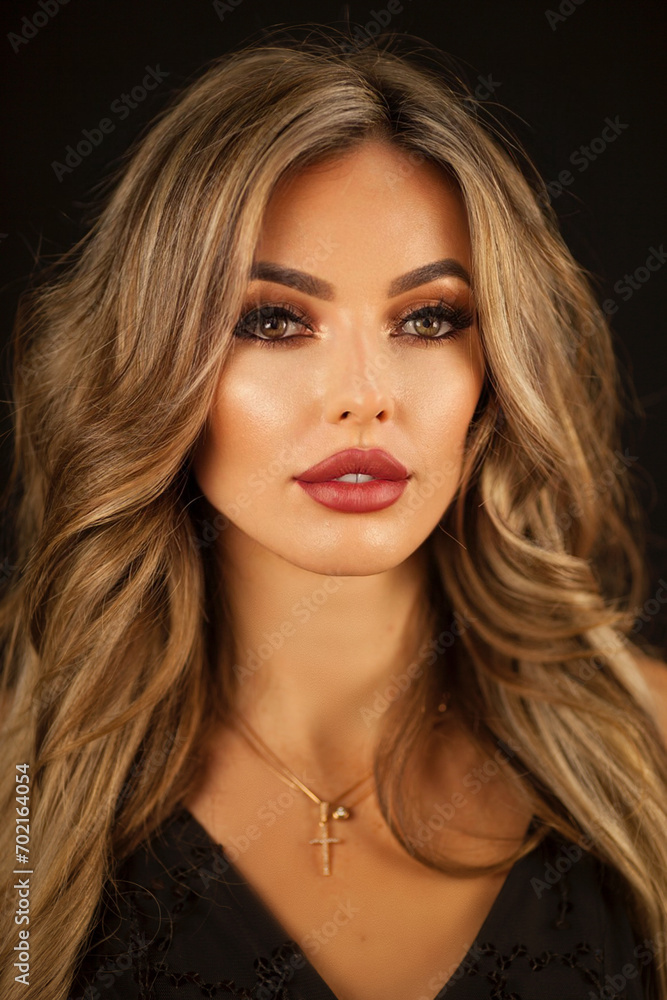 Fototapeta premium Blonde hair. beautiful sexy blonde girl. Beauty isolated on black background