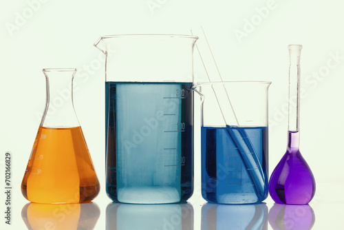  Scientific experiment with empty glass containers and lab equipment on white background