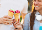 Cute young beautiful teen couple in city near university with ice cream