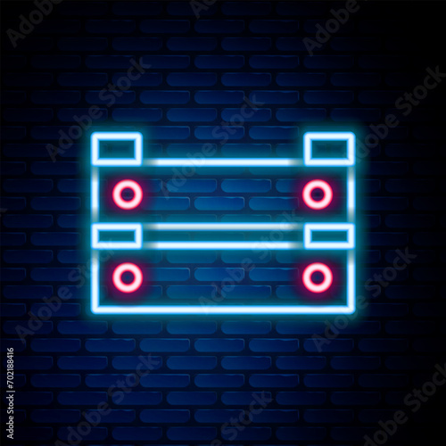 Glowing neon line Wooden box icon isolated on brick wall background. Grocery basket, storehouse crate. Empty wooden container for vegetables, products. Colorful outline concept. Vector