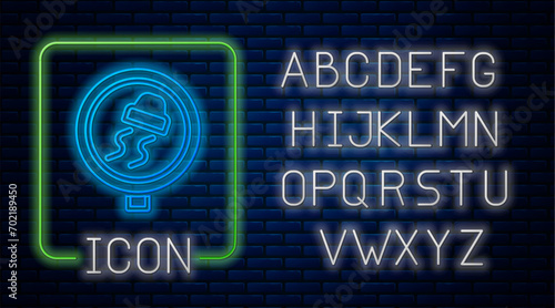 Glowing neon Slippery road traffic warning icon isolated on brick wall background. Traffic rules and safe driving. Neon light alphabet. Vector